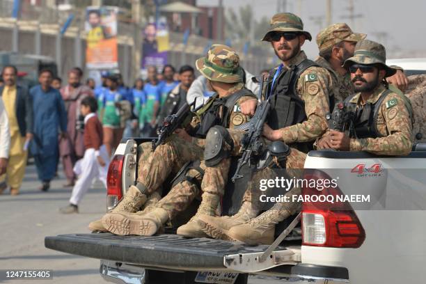 Pakistan's army soldiers arrive at the Multan Cricket Stadium before the start of the Pakistan Super League Twenty20 cricket match between Multan...