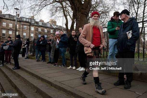 People gather stand outside of Bute House as a press conference is held by Scotland's First Minister Nicola Sturgeon on February 15, 2023 in...