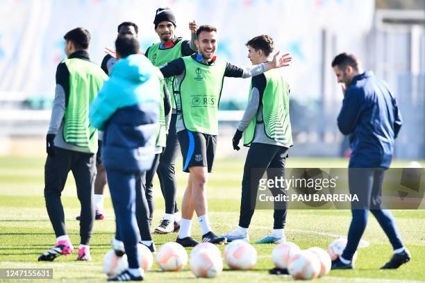 Barcelona's Uruguayan defender Ronald Araujo and teammates attend a training session on the eve of their UEFA Europa League play-offs football match...