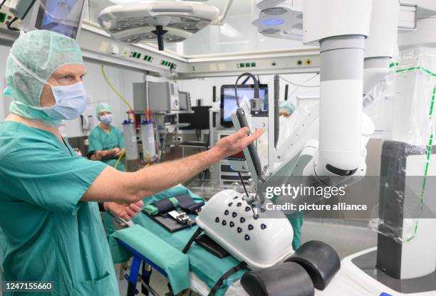 February 2023, Saxony, Dresden: Surgeon Sören Torge Mees presents the latest generation DaVinci surgical system during a press event at the Dresden...