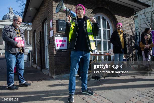 University staff from the University and College Union stand at an official picket outside University College London during strike action on 15...