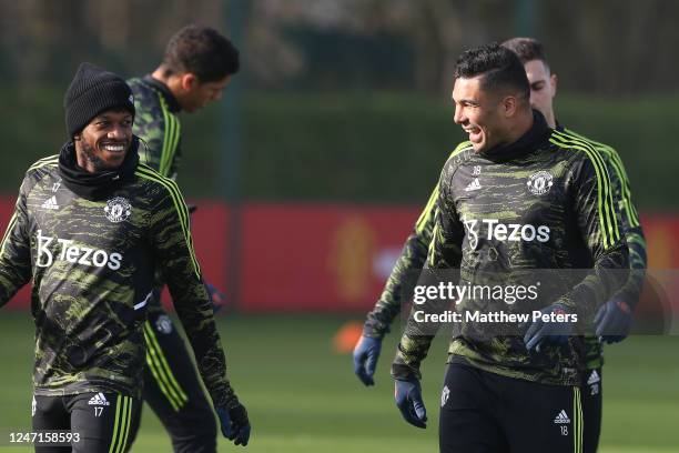 Casemiro of Manchester United reacts to Fred during a first team training session at Carrington Training Ground on February 15, 2023 in Manchester,...