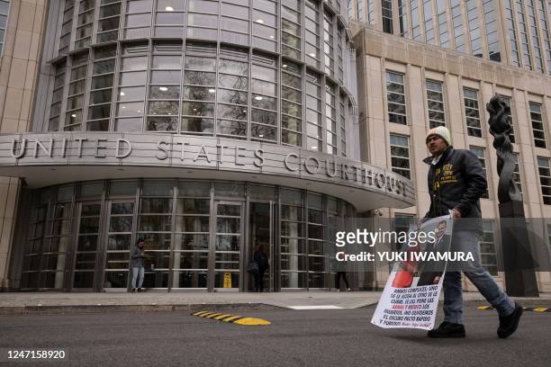 Man protests outside the courthouse where the closing arguments for the trial of the former Mexican Secretary of Public Security Genaro Garcia Luna...