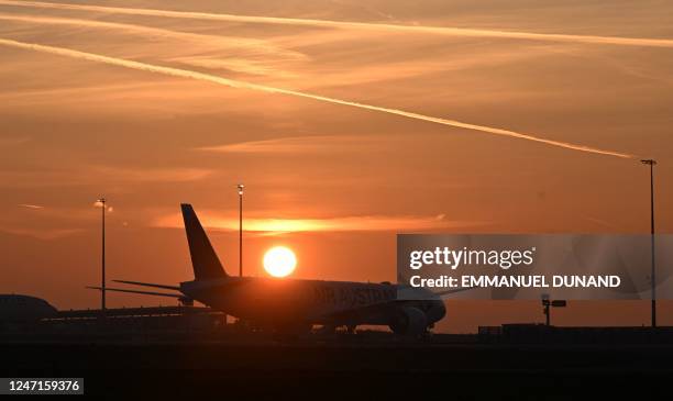 An airplane sits on the tarmac at Roissy-Charles de Gaulle airport in the Paris suburb of Roissy on February 15, 2023.