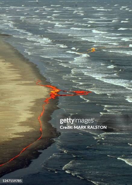 Oil boom barriers that are expected to stop the spread of oil from the BP Deepwater Horizon platform disaster, lies washed up on the beach after...