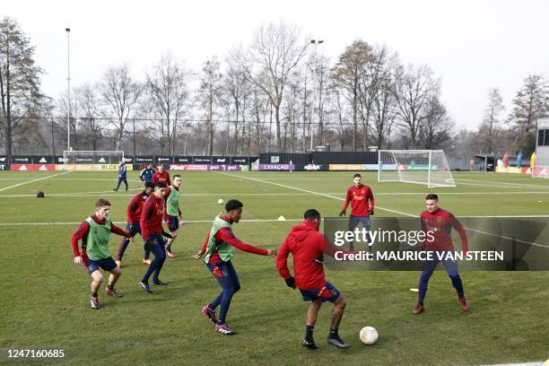 Ajax's players take part in a training session on the eve of the UEFA Europa League round of 32 football match between Ajax Amsterdam and FC Union...