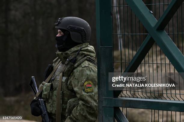 Belarusian border guards patrol along the frontier near the Divin border crossing point between Belarus and Ukraine in the Brest region on February...