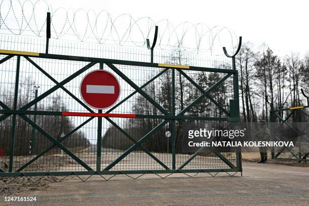 Belarusian border guards patrol along the frontier near the Divin border crossing point between Belarus and Ukraine in the Brest region on February...