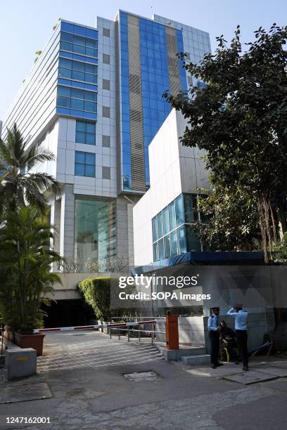 Security guards are standing below the BBC office located on the fifth floor of Windsor building in Mumbai. Income Tax officials investigate the BBC...