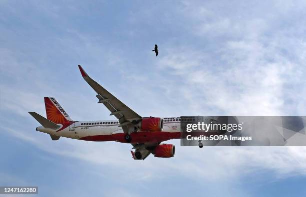 An Air India plane seen flying in the sky in Mumbai. Air India placed an order for 470 planes, out of which 250 will be Airbus and 220 will be Boeing...