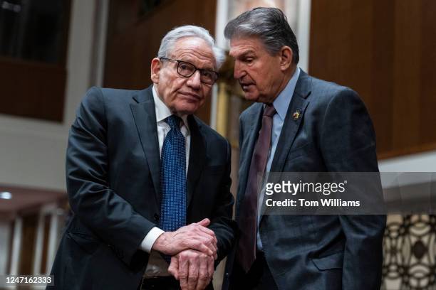 Sen. Joe Manchin, D-W.Va., right, talks with journalist Bob Woodward during the Senate Armed Services Committee hearing on Global Security Challenges...