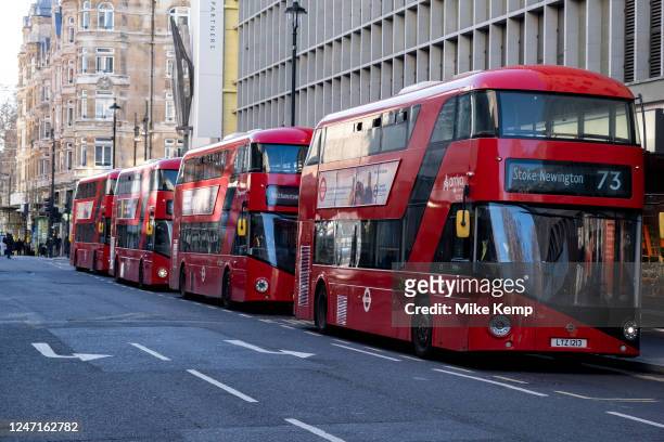 Red London New Routemaster buses parked in-line just off Oxford Street on 6th February 2023 in London, United Kingdom. The New Routemaster,...