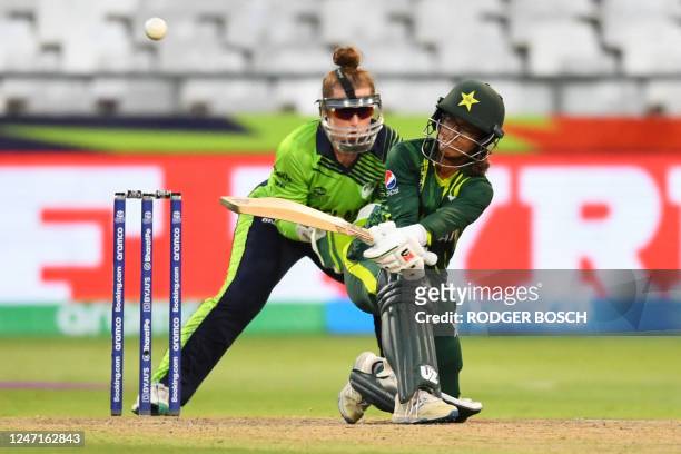 Pakistan's Muneeba Ali plays a shot as Ireland's wicketkeeper Mary Waldron looks on during the Group B T20 women's World Cup cricket match between...