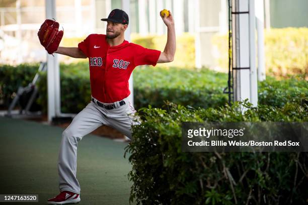 Chris Sale of the Boston Red Sox practices pitching during a Boston Red Sox spring training team workout on February 15, 2023 at jetBlue Park at...