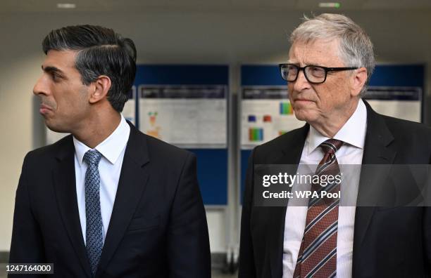 Britain's Prime Minister Rishi Sunak and Microsoft founder Bill Gates speak with members of H2GO Power, a company aiming at developing technologies...