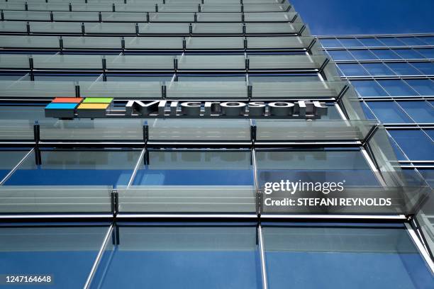 The Microsoft logo is displayed on an office building in Washington, DC, on February 15, 2023. - Retail sales in the United States rebounded in...