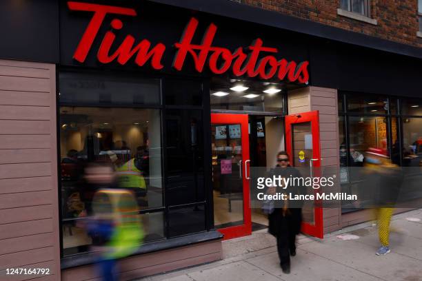 February 15: A person walks out of a Tim Hortons store on Yonge St. In Toronto. Toronto Star/Lance McMillan February-15-2023