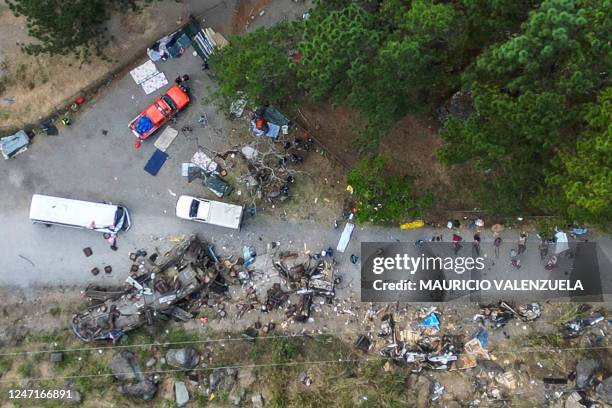 Graphic content / Aerial view of the aftermath after a bus transporting migrant people crashed in Gualaca, Panama on February 15, 2023. - At least 39...