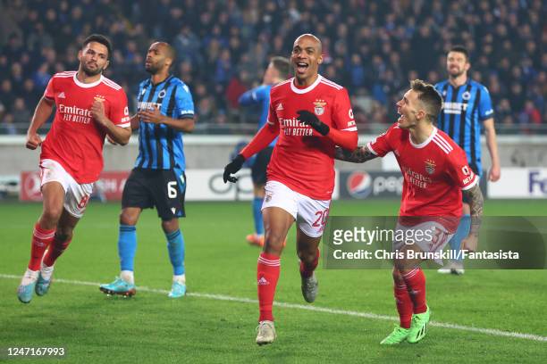 Joao Mario of Benfica celebrates scoring a goal to make the score 0-1 during the UEFA Champions League round of 16 leg one match between Club Brugge...