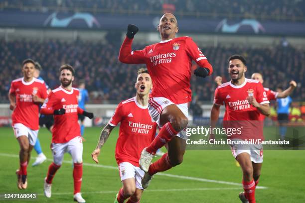 Joao Mario of Benfica celebrates scoring a goal to make the score 0-1 with his team-mates during the UEFA Champions League round of 16 leg one match...