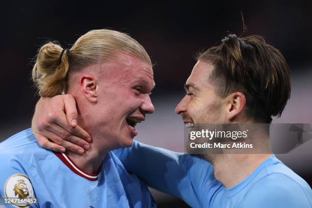 Erling Haaland of Manchester City celebrates the win with Jack Grealish during the Premier League match between Arsenal FC and Manchester City at...