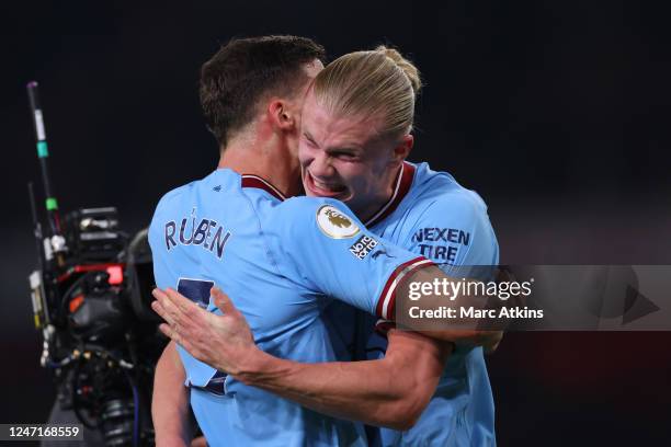 Erling Haaland of Manchester City celebrates the win with Ruben Dias during the Premier League match between Arsenal FC and Manchester City at...