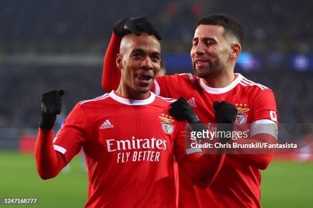 Joao Mario of Benfica celebrates scoring a goal to make the score 0-1 with Nicolas Otamendi during the UEFA Champions League round of 16 leg one...