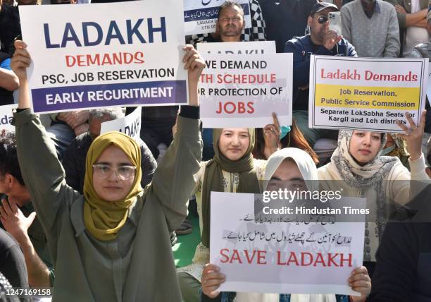 Protestors hold placards during a protest demanding statehood for the Ladakh region on February 15, 2023 in New Delhi, India. Ladakh was separated...