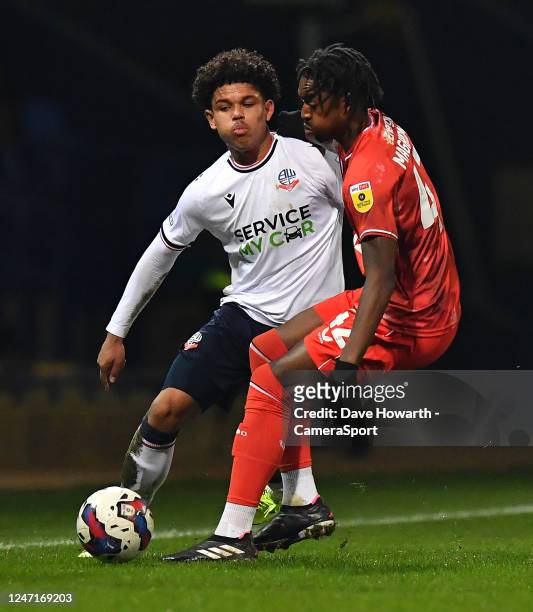 Bolton Wanderers' Shola Shoretire battles with Milton Keynes Dons' Paris Maghoma during the Sky Bet League One between Bolton Wanderers and Milton...
