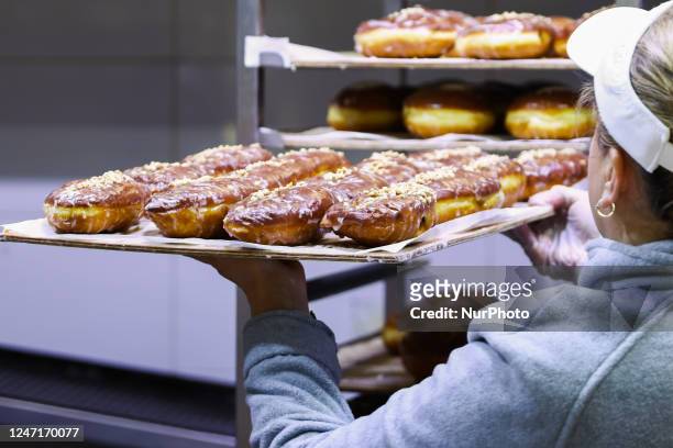 Bakery 'Dobra Paczkarnia' produces donuts a day ahead of Fat Thursday. Krakow, Poland on February 16, 2023. Fat Thursday is a traditional Catholic...