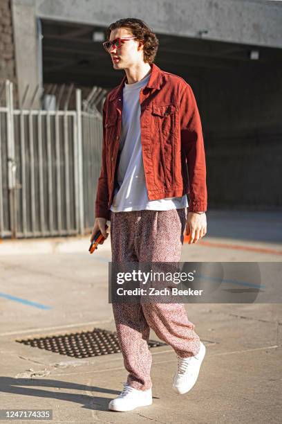 Josh Giddey of the Oklahoma City Thunder arrives to the arena before the game against the Houston Rockets on February 15, 2023 at Paycom Arena in...