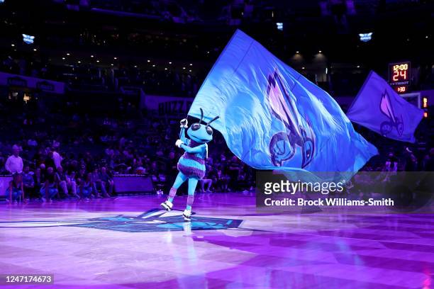 The Charlotte Hornets mascot, Hugo waves a flag prior to the game against the San Antonio Spurs on February 15, 2023 at Spectrum Center in Charlotte,...
