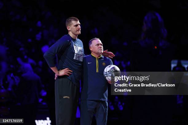 Nikola Jokic and Head Coach Michael Malone of the Denver Nuggets are recognized for making the NBA All-Star team at Ball Arena on February 15, 2023...