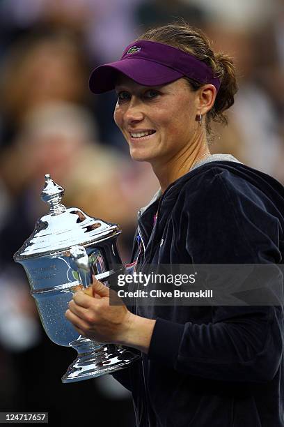 Samantha Stosur of Australia celebrates with the championship trophy defeating Serena Williams of the United States to win the Women's Singles Final...