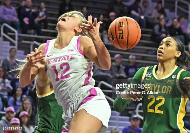 Gabby Gregory of the Kansas State Wildcats is fouled driving to the basket against Jaden Owens of the Baylor Bears during a game in the second half...
