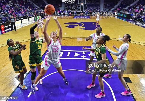 Gabby Gregory of the Kansas State Wildcats shoots the ball against Caitlin Bickle of the Baylor Bears during a game in the first half at Bramlage...