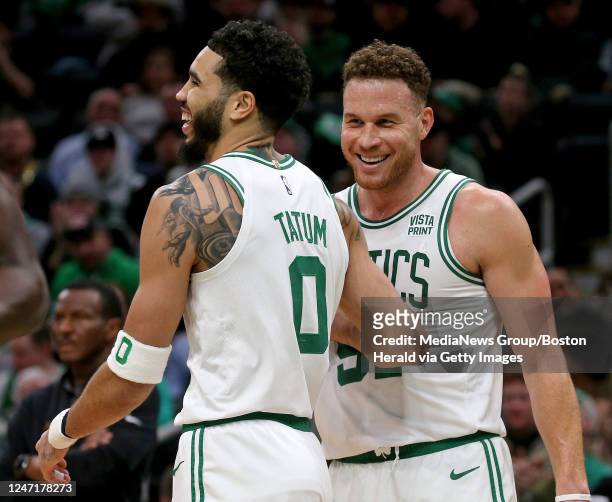 February 15: Jayson Tatum and Blake Griffin of the Boston Celtics celebrate during the first half of the NBA game against the Detroit Pistons at the...