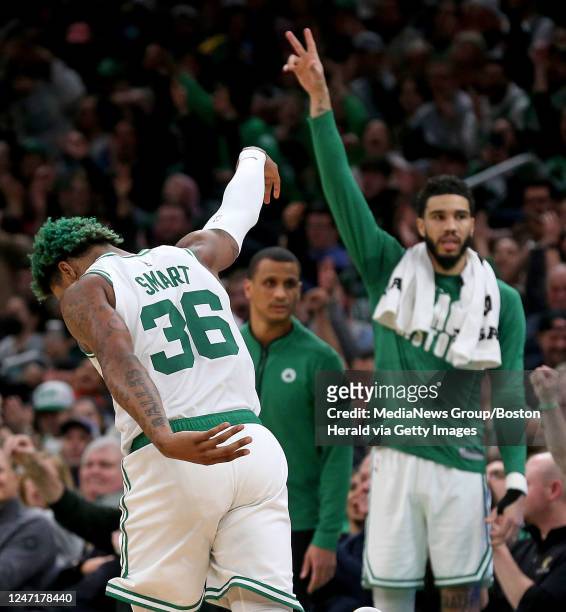 February 15: Marcus Smart of the Boston Celtics celebrates his 3-pointer with Jayson Tatum during the first half of the NBA game against the Detroit...