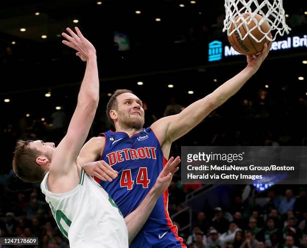 February 15: Bojan Bogdanovic of the Detroit Pistons elbows Luke Kornet of the Boston Celtics in the face during the second half of the NBA game at...