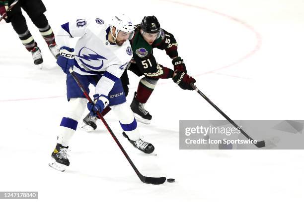 Tampa Bay Lightning left wing Nicholas Paul skates with the puck against Arizona Coyotes defenseman Troy Stecher during the second period of a Hockey...