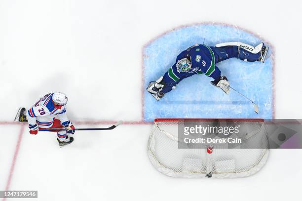 Chris Kreider of the New York Rangers scores a goal on Arturs Silovs of the Vancouver Canucks during the second period of their NHL game at Rogers...