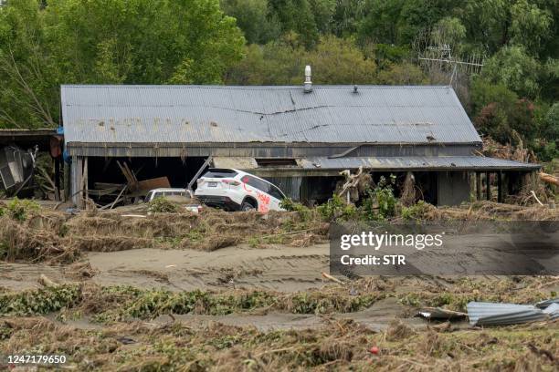 This photo shows an area damaged by flooding in the aftermath of Cyclone Gabrielle near Napier on February 16, 2023. - New Zealand is under a...