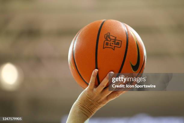 An official holds up the game ball with the Bowling Green logo during a timeout during the third quarter of a Mid-American Conference regular season...