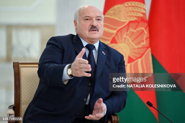 Belarus' President Alexander Lukashenko speaks as he meets with foreign media at his residence, the Independence Palace, in the capital Minsk on...