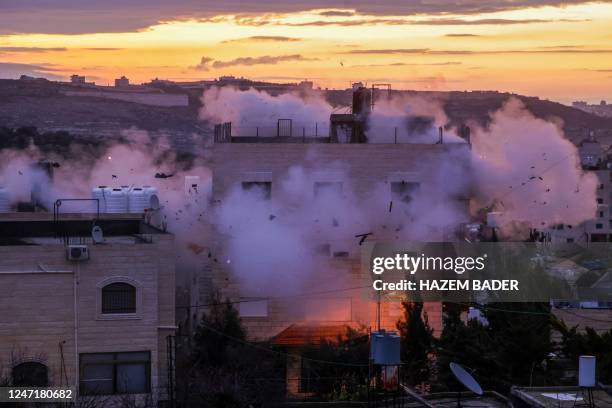 Smoke billows as the residence of Mohammad al-Jaabari, a Palestinian who carried out a shooting attack last year, is demolished by Israeli forces in...