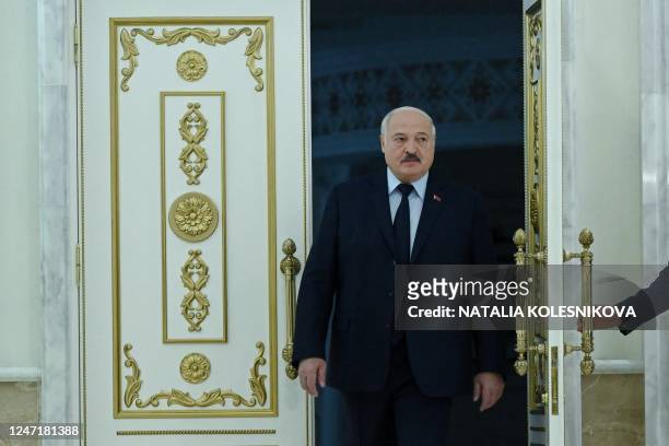 Belarus' President Alexander Lukashenko enters a hall to meet with foreign media at his residence, the Independence Palace, in the capital Minsk on...
