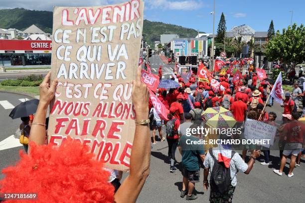 Protester holds a sign reading "The future is not what will happen but what we will do together" during a demonstration on the fifth day of...