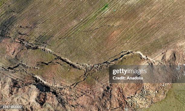 An aerial view of a barley field at the district of Islahiye in Gaziantep, Turkiye on February 16, 2023. Long and deep crevices were formed after the...