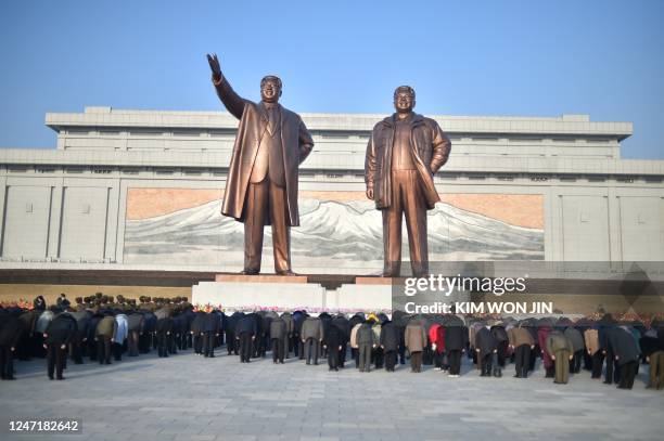 People visit the statues of late North Korean leaders Kim Il-Sung and Kim Jong-Il to pay their respects on the occasion of the birthday of late North...