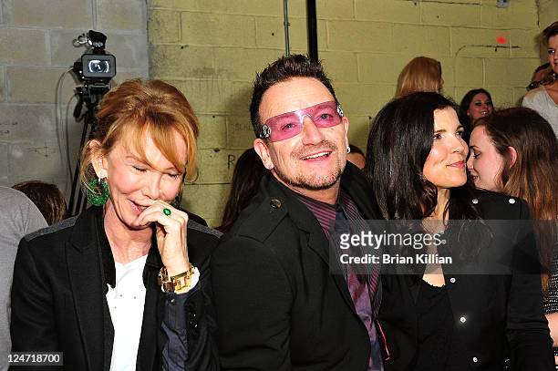 Trudie Styler, Bono, and Alison Hewson attend the Edun Spring 2012 fashion show during Mercedes-Benz Fashion Week at 330 West Street on September 11,...
